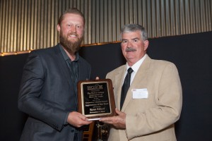 2016 Interior Finish Carpenter Apprentice of the Year Ryan Eiford is presented his award by WCIAF Chairman Ed Gittemeier.